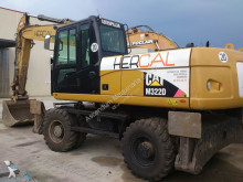escavatore gommato Caterpillar