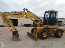 graafmachine op banden Komatsu