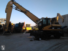 escavatore per movimentazione Caterpillar