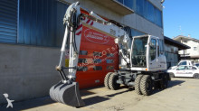 escavatore gommato usato