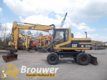 escavatore gommato Caterpillar