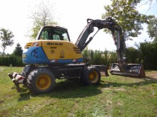 escavatore gommato Mecalac