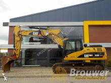 escavatore intermediario strada/rotaia Caterpillar