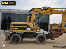 graafmachine op banden Caterpillar