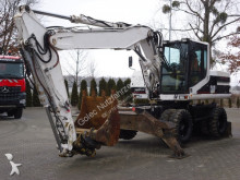 escavatore gommato nc