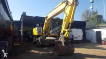 escavatore gommato New Holland