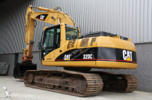 escavatore intermediario strada/rotaia Caterpillar
