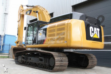 escavatore intermediario strada/rotaia Caterpillar