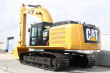 escavatore intermediario strada/rotaia Caterpillar
