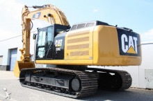 escavatore intermediario strada/rotaia Caterpillar