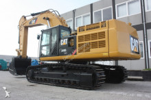 escavatore intermediario strada/rotaia Caterpillar