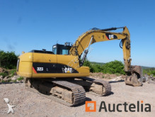 escavatore intermediario strada/rotaia Caterpillar