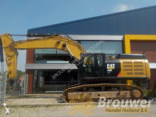 escavatore intermediario strada/rotaia Caterpillar
