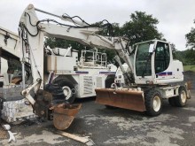 escavatore gommato New Holland