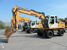 escavatore gommato nc