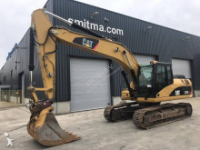 escavatore intermediario strada/rotaia Caterpillar