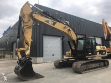 escavatore intermediario strada/rotaia Caterpillar