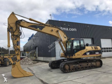 escavatore intermediario strada/rotaia Caterpillar