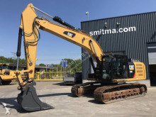 escavatore intermediario strada/rotaia Caterpillar