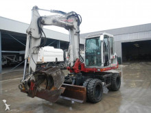escavatore gommato Takeuchi