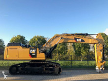 escavatore intermediario strada/rotaia Caterpillar
