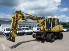 graafmachine op banden Atlas