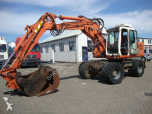 graafmachine op banden Atlas
