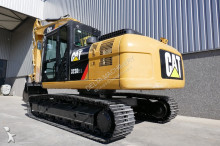 escavatore intermediario strada/rotaia Caterpillar
