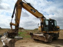 graafmachine op banden Caterpillar