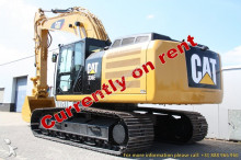 escavatore intermediario strada/rotaia Caterpillar