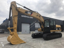 escavatore intermediario strada/rotaia Caterpillar
