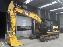 escavatore intermediario strada/rotaia Caterpillar