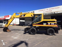 pelle sur pneus Caterpillar