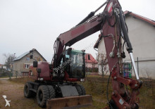graafmachine op banden Caterpillar