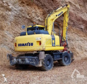 graafmachine op banden Komatsu