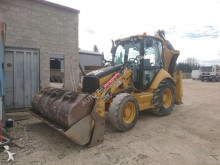 экскаватор-погрузчик с жесткой рамой Caterpillar