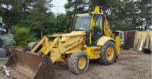 экскаватор-погрузчик с жесткой рамой Komatsu