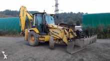 экскаватор-погрузчик с жесткой рамой Komatsu