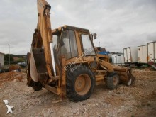 экскаватор-погрузчик с жесткой рамой Caterpillar