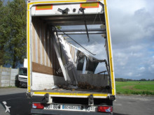 damaged flatbed semi-trailer